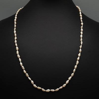 Lot 337 - A BAROQUE FRESHWATER PEARL SINGLE STRAND OPERA NECKLACE