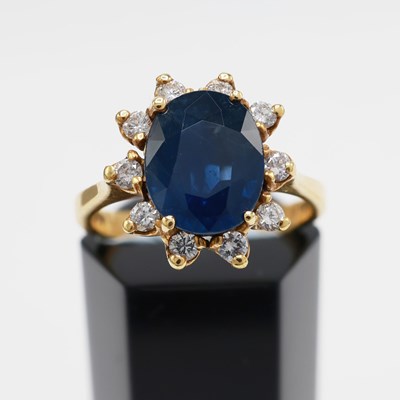 Lot 272 - AN 18CT GOLD SAPPHIRE AND DIAMOND DRESS RING