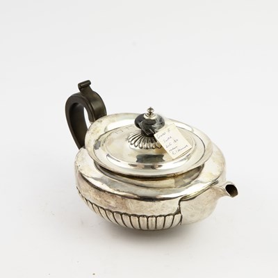 Lot 205 - A REGENCY SILVER TEA POT.