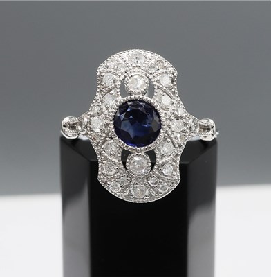 Lot 223 - A PLATINUM SAPPHIRE AND DIAMOND DRESS RING
