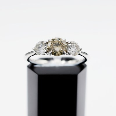 Lot 215 - A PLATINUM DIAMOND TRILOGY RING