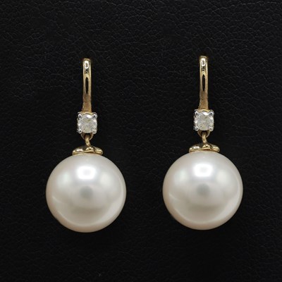 Lot 250 - A PAIR OF 9CT GOLD PEARL AND DIAMOND SET EARRINGS