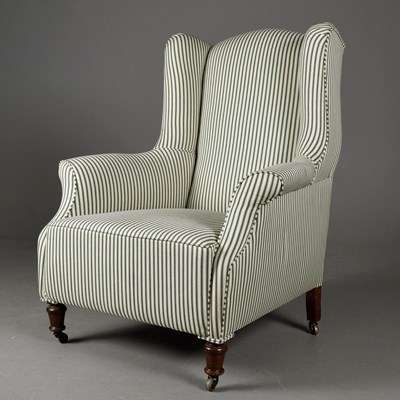 Lot 314 - VICTORIAN WING ARMCHAIR IN GREEN TICKING.
