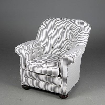 Lot 547 - TICKING BUTTONED TUB CHAIR.