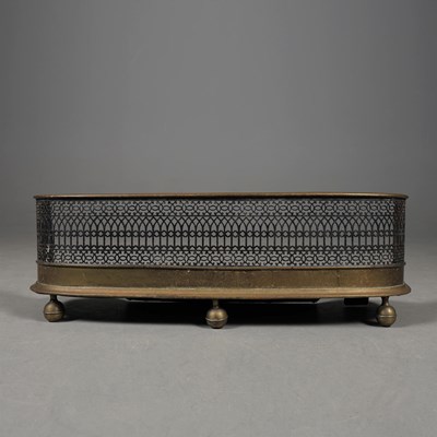 Lot 277 - VICTORIAN BRASS AND IRON FENDER.