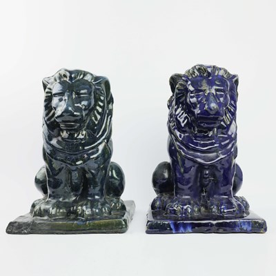 Lot 134 - TWO GLAZED TERRACOTTA LIONS (2)