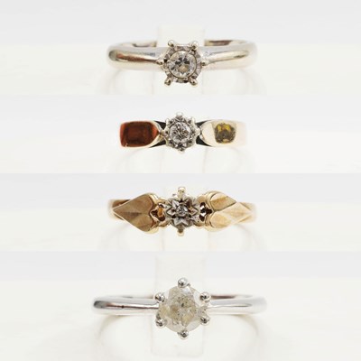 Lot 255 - A COLLECTION OF FOUR 9CT GOLD DIAMOND SOLITAIRE RINGS