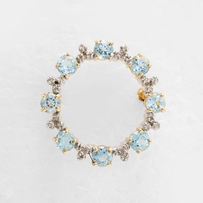 Lot 287 - A 9CT GOLD, BLUE TOPAZ AND DIAMOND SET BROOCH.