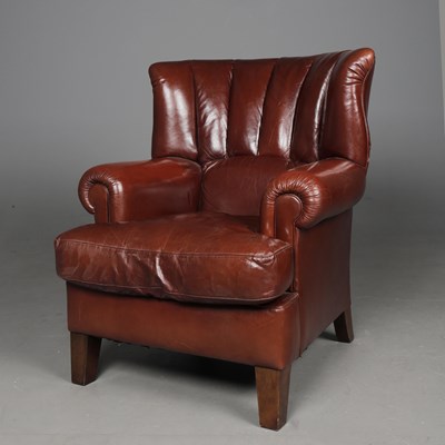 Lot 469 - BROWN LEATHER WING ARMCHAIR