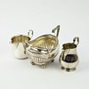Lot 82 - A SILVER SAUCE BOAT, A SILVER CREAM JUG AND A SILVER PLATED MILK JUG
