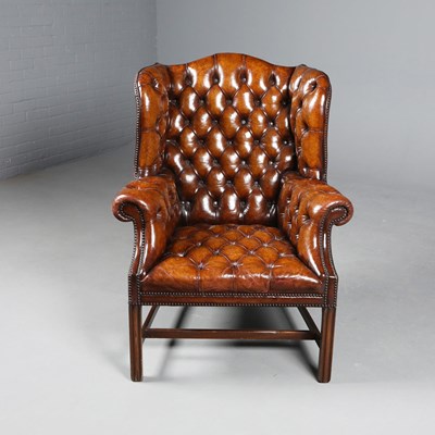 Lot 164 - GEORGIAN STYLE WING ARMCHAIR.