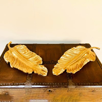 Lot 262 - PAIR OF GILT METAL TROPICAL LEAF SERVING DISHES.