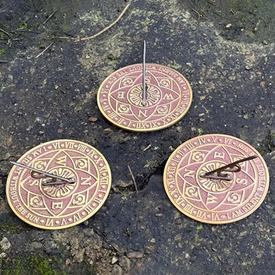 Lot 333 - SET OF THREE METAL SUNDIALS.