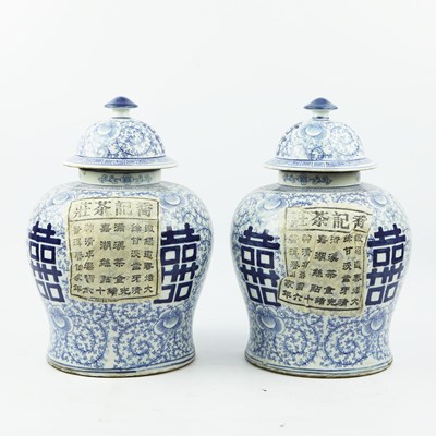 Lot 348 - CHINESE STYLE BLUE AND WHITE CERAMIC JARS, A PAIR.