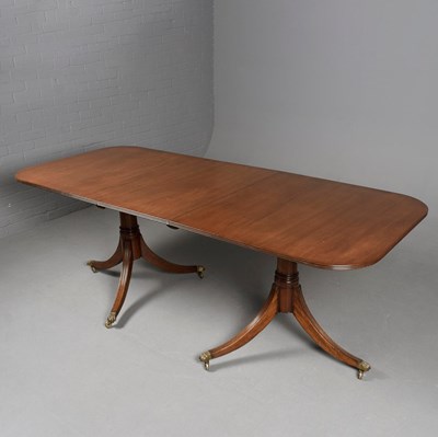 Lot 404 - A REGENCY STYLE MAHOGANY TWIN-PEDESTAL DINING TABLE.