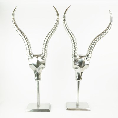 Lot 225 - PAIR OF ANDREW MARTIN POLISHED METAL ANTELOPE HEAD SCULPTURES.