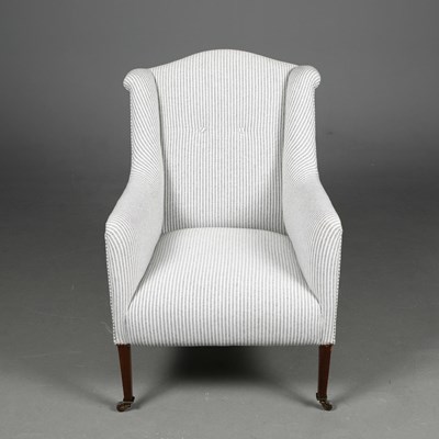 Lot 386 - EDWARDIAN MAHOGANY WING ARMCHAIR.