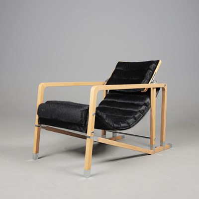 Lot 1 - TRANSAT CHAIR BY EILEEN GRAY FOR ECART INTERNATIONAL.