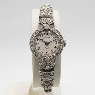Lot 178 - A CARTIER ART DECO PLATINUM AND DIAMOND SET COCKTAIL WATCH.