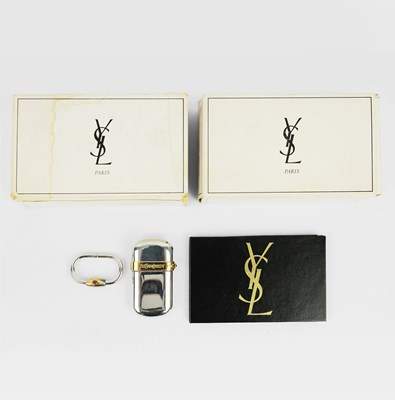 Lot 207 - YVES SAINT LAURENT, A CIGARETTE LIGHTER AND A MATCHING KEY RING.