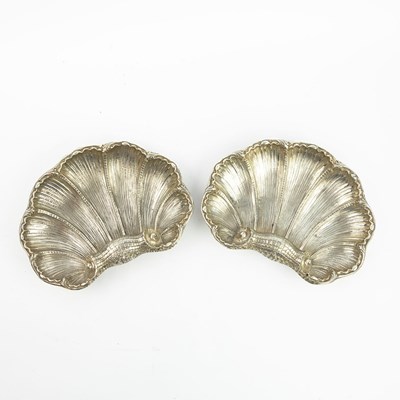 Lot 198 - A PAIR OF STERLING SILVER SHELL SHAPED SERVING DISHES.