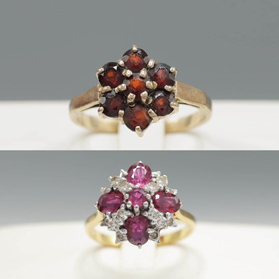 Lot 303 - TWO YELLOW METAL DRESS RINGS.