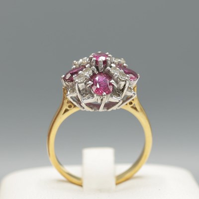 Lot 275 - AN 18CT GOLD RUBY AND DIAMOND DRESS RING.